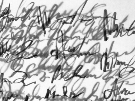 Old unreadable handwriting text on white paper.の写真素材