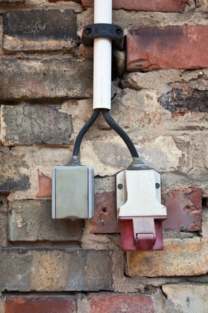 power and high-power current on brick wall