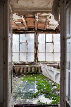old winter garden - derelict room with large windowsの写真素材