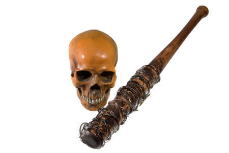 barbed wire baseball bat with human skull isolated white backgroundの写真素材