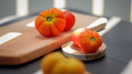 heap of heirloom or hillbilly tomato isolated on black backgroundの写真素材