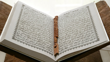 Conceptual image of religion. Holy tasbih or islamic prayer beads and Quran. Ramadan theme backgroundの写真素材