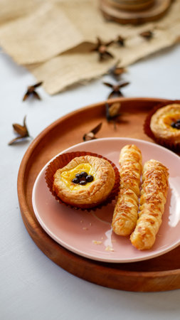 cheesy egg tart and cheese roll, crispy puff pastry with cheese stick inside.の写真素材