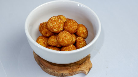 Palm sugar cookies on a white bowl, in bright mood. Round cookies coating with palm sugar.