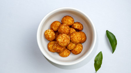 Palm sugar cookies on a white bowl, in bright mood. Round cookies coating with palm sugar.の写真素材