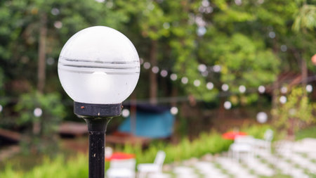 rural park lamp, white lamp on a steel pole, outdoor, selective focus.の写真素材