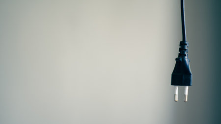 Hanging black electric cable and plugの写真素材