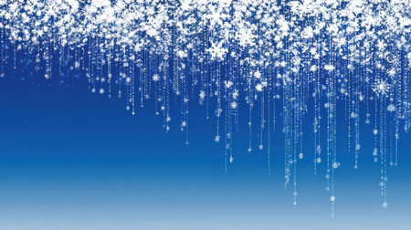 A stunning winter image featuring delicate snowflakes cascading from above against a gradient blue background, creating a dreamy festive atmosphere.の素材