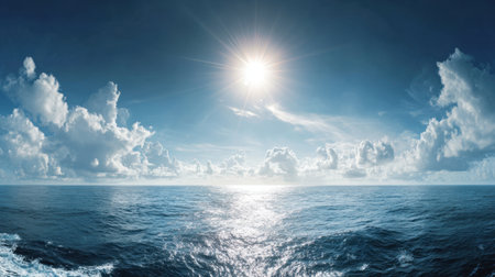 A breathtaking view of a serene ocean horizon illuminated by bright sunlight, showcasing fluffy clouds above calm blue waters, perfect for relaxation.の素材