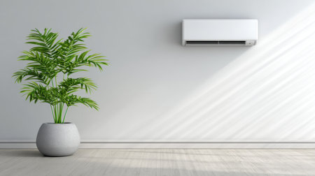 A serene modern interior featuring a wall-mounted air conditioner and a vibrant potted plant, creating a balanced and inviting atmosphere. The minimalist design emphasizes comfort and style, with natural lighting casting soft shadows.の素材