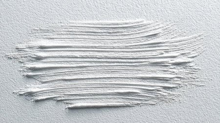 A captivating close-up of a smooth white texture featuring brush stroke patterns on canvas, perfect for artistic projects and creative backgrounds.の素材