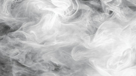 This image captures flowing white smoke against a dark background, creating an ethereal and abstract visual effect with a sense of mystery and depth.の素材