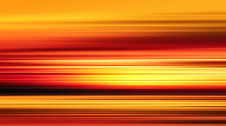 This stunning image captures a vibrant sunset over tranquil waters, showcasing a spectacular blend of orange, red, and yellow hues in a mesmerizing gradient.の素材