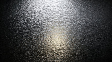 A serene aerial view captures the reflective surface of calm water, illuminated by bright sunlight, creating enchanting glimmering patterns in nature.の素材