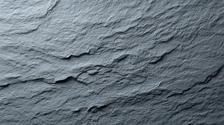 Close-up of a textured gray slate surface, showcasing unique patterns and subtle variations for artistic and design uses in various applications.の素材