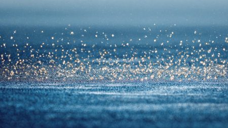 A mesmerizing close-up view of raindrops sparkling on a tranquil water surface, capturing the beauty of nature during early morning light.の素材
