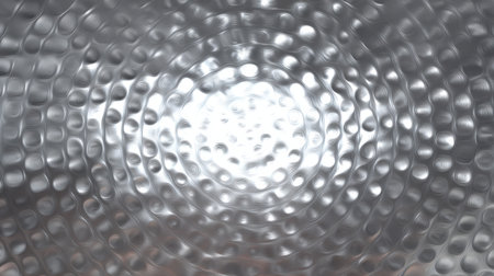 This abstract metallic background features smooth circular patterns and light reflections, perfect for artistic designs or creative projects.の素材