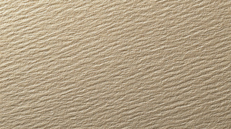 This textured gold paper background features subtle linear patterns, ideal for creating elegant designs, art projects, or sophisticated presentations.の素材