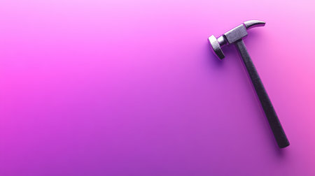 A strong metallic hammer rests on a vibrant purple background, showcasing a smooth gradient. This striking tool symbolizes craftsmanship, ideal for creative projects.の素材