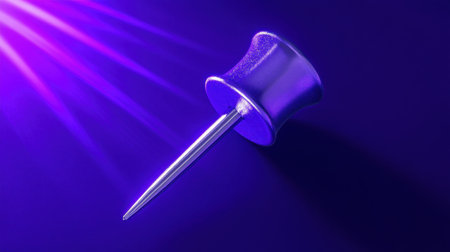 This close-up image features a vibrant purple push pin on a dark background, highlighted by dynamic light rays, symbolizing creativity and organization.の素材