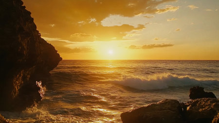 A mesmerizing sunset illuminates the ocean waves, creating a stunning scene with a dramatic sky and rocky shoreline. Perfect for travel and nature themes.の素材