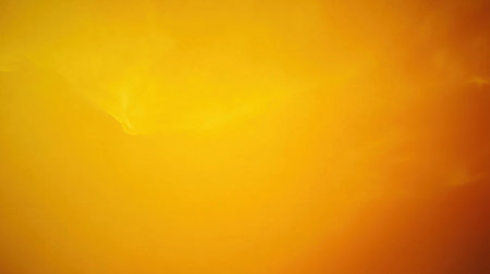 This striking abstract background features a beautiful gradient of golden yellow and vibrant orange hues, perfect for creative projects and designs.の素材