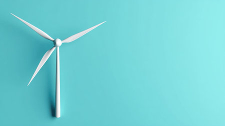 A minimalist conceptual image featuring a modern wind turbine against a bright turquoise background, symbolizing renewable energy and sustainability initiatives.の素材