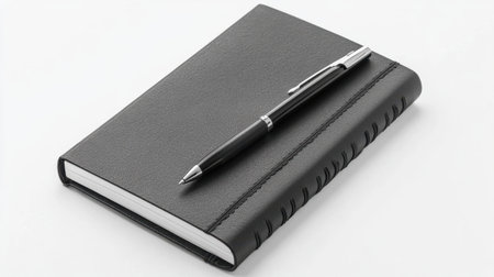 A sleek black leather notebook with a stylish pen rests on a clean white background, ideal for both corporate and personal use. Perfect for writing notes and ideas.の素材