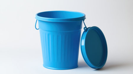 A bright blue plastic trash bin with a lid, ideal for waste management and household organization, showcasing a minimalistic design with practicality.の素材