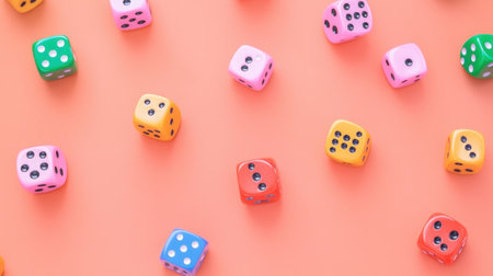 A dynamic arrangement of colorful dice scattered on a bright orange surface. Ideal for game nights or educational activities, this vibrant scene captures the essence of fun and chance.の素材