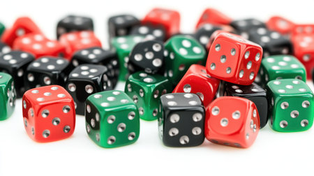 A vibrant collection of colorful dice in red, green, black, and various styles, perfect for board games, creative projects, and playful activities.の素材