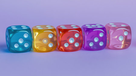 A vibrant arrangement of five colorful transparent dice, showcasing yellow, blue, pink, orange, and purple hues on a soft pastel background, ideal for gaming and fun themes.の素材