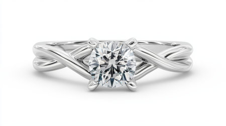 This stunning engagement ring features a brilliant round diamond set in an elegant silver band with intricate twisted design, symbolizing love and commitment.の素材
