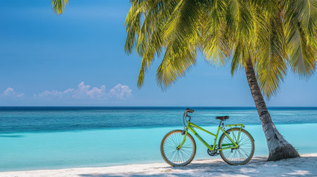 A striking green bicycle rests beside a palm tree on a sunny beach. The scene features turquoise waters and a clear blue sky, showcasing a tranquil seaside paradise perfect for relaxation and adventure.の素材