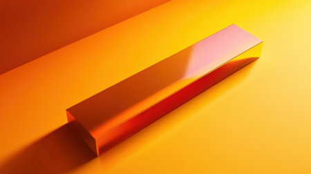 A clean and vibrant geometric shape is positioned on a bright yellow and orange surface, creating an engaging interplay of color and shadow in a minimalistic style.の素材