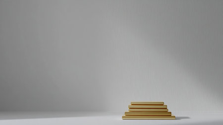 Elegant arrangement of golden stacked blocks on a white surface, showcasing a minimalist design with soft shadows and neutral background for versatile use.の素材