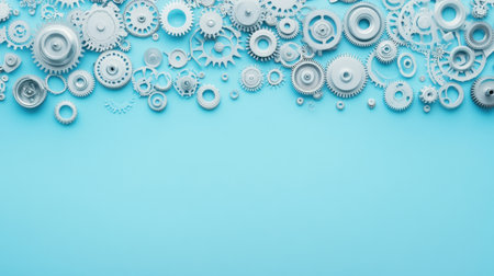 This image features a stylish arrangement of metallic gears and cogs against a light blue background, perfect for themes of technology, engineering, and innovation.の素材