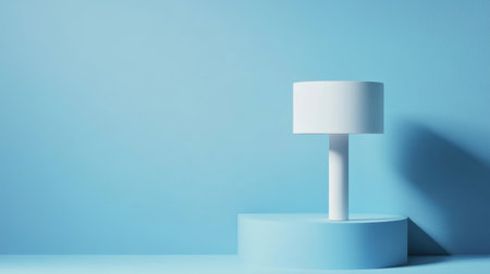 A minimalist white lamp rests on a circular base against a soft blue background, embodying modern interior design elements that enhance tranquility.の素材
