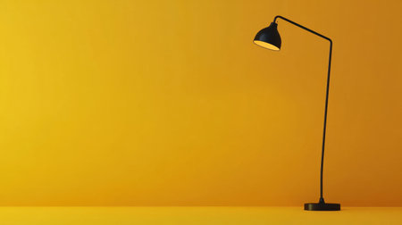 This image features a sleek black desk lamp with a yellow shade against a vibrant yellow wall, perfect for modern home decor and minimalist inspiration.の素材