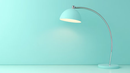 A sleek turquoise desk lamp with a metallic base stands against a smooth backdrop, creating a tranquil atmosphere perfect for focused work or relaxation.の素材