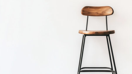 This image showcases a modern wooden stool with a sleek metal frame, set against a bright white background, perfect for interior design inspiration.の素材