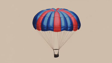 A vibrant parachute with bold blue and red colors glides gracefully through the air, showcasing the thrill of adventure and the beauty of flight.の素材