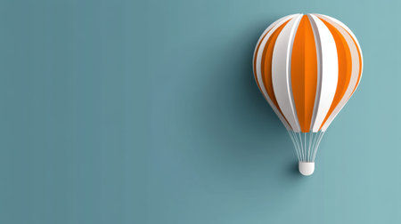 A vibrant hot air balloon featuring orange and white stripes floats effortlessly against a soft blue wall, capturing the essence of adventure and freedom.の素材