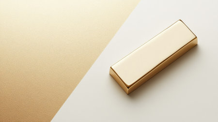 A polished gold bar rests on a minimalist background, embodying luxury and wealth. This image captures the elegance and sophistication of premium design.の素材