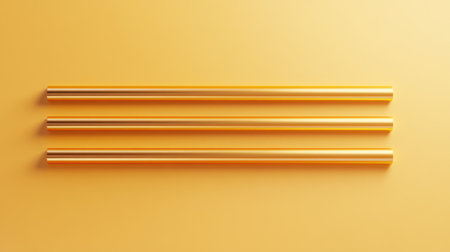 This image showcases three golden metallic straws against a warm yellow background, highlighting a minimalist and modern design for eco-friendly drink accessories.の素材