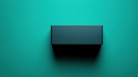 This image features a minimalist black box positioned on a vibrant teal background, ideal for modern design projects, branding needs, and creative presentations.の素材