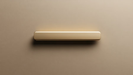 A sleek gold bar against a soft beige background creates an elegant minimalist aesthetic. The subtle lighting enhances the texture, offering a refined, modern look.の素材