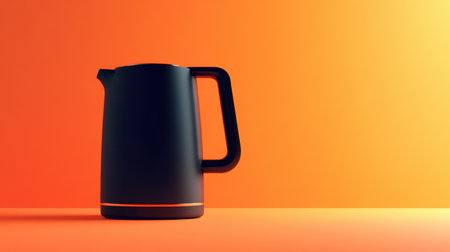 This image showcases a sleek black kettle against a vibrant orange backdrop. The modern design and contrasting colors make it an ideal choice for kitchen decor and culinary imagery.の素材