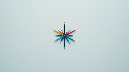 This image features a vibrant arrangement of colored pencils and markers radiating from a central point, set against a soft background. Ideal for creative projects.の素材