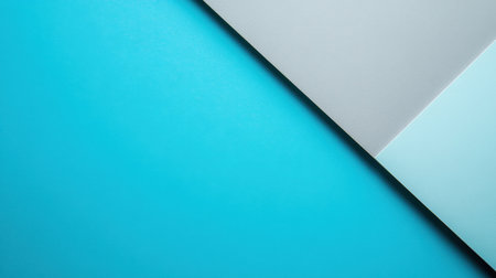 This abstract background features soft blue and gray tones with geometric shapes, perfect for design projects, wallpapers, and creative artwork.の素材